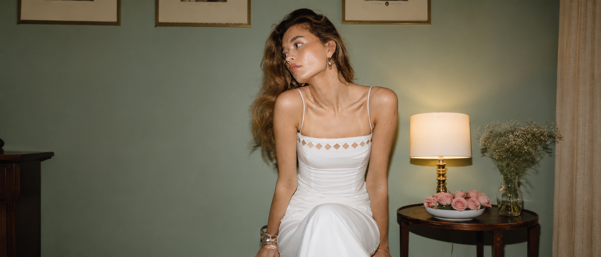 Woman wearing a delicate white occasion dress