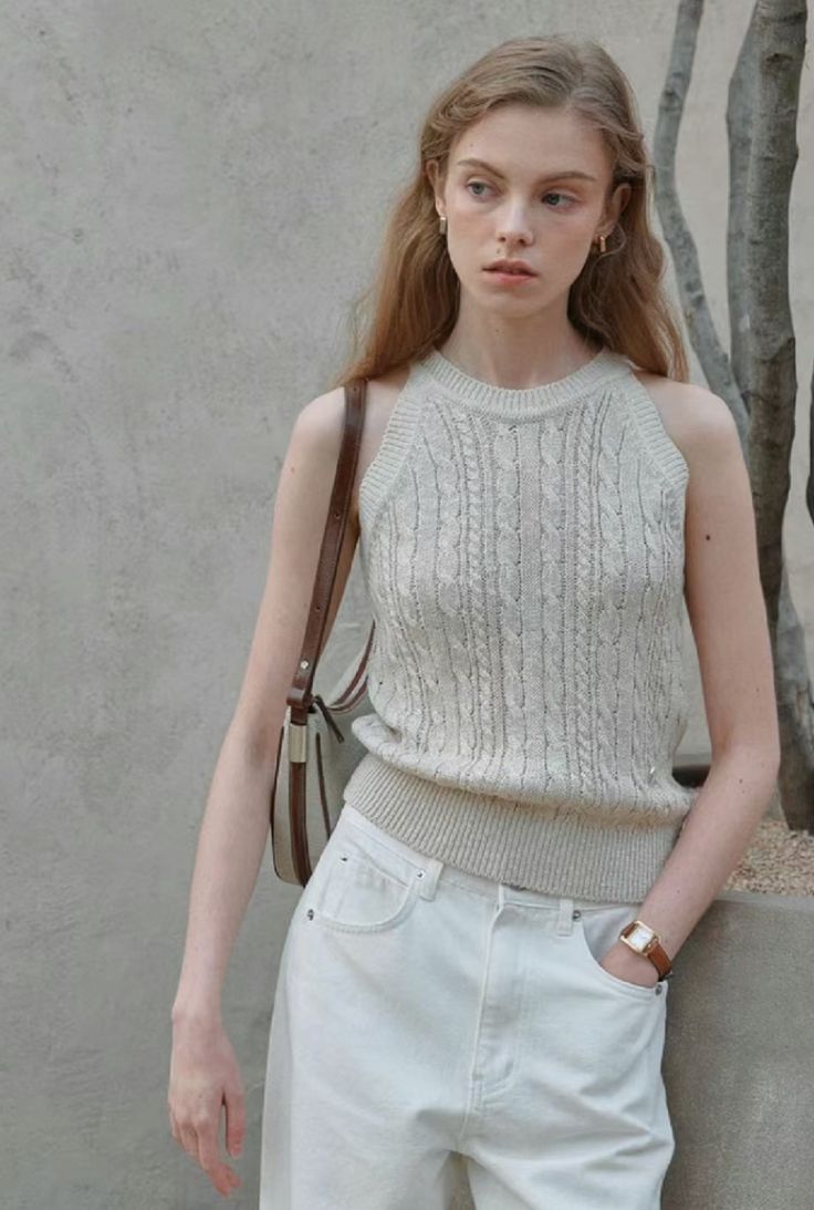 Woman wearing a sleeveless textured knit top